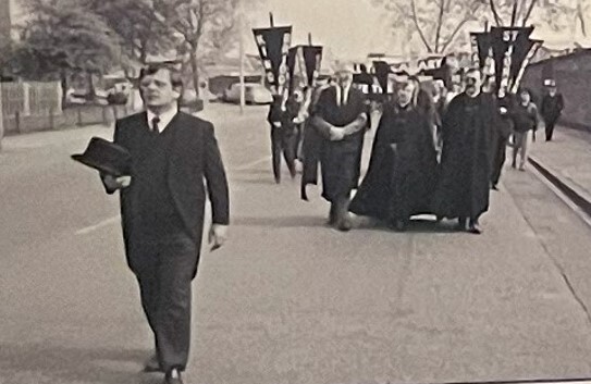 March Led by Peter Wade to the Island of Prince Charles: Protesters Dressed in Funeral Attire is Meant to Signify the Death of the Community