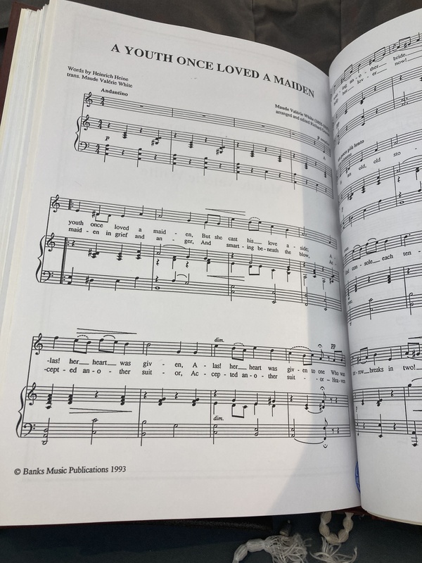 Picture of the first page of the first movement of Two Love Songs entitled "A Youth Once Loved a Maiden". It was composed by Maude Val&eacute;rie White and contains words by Heinrich Heine translated by White.