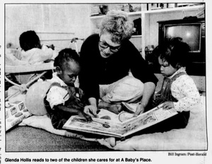 Glenda Hollis reads to children at A Baby's Place