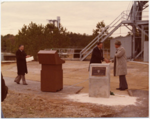 Bernhard Tessmann, at right, receives congratulations from  William R. Lucas.