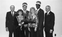1990 Homecoming court posing with interim president Joe Moquin.