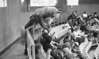 UAH mascot interacting with fans at the 1987 Homecoming hockey game against Ohio University.