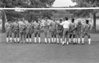 Members of the 1993-1994 men's soccer team lining up for photos.