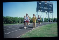 UAH track athletes running.