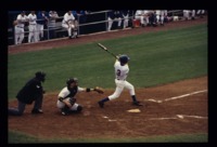 Player batting during a UAH baseball game.