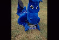 UAH mascot Charger Blue posing with a UAH license plate.