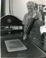 Art professor Michael Crouse at a printing press.