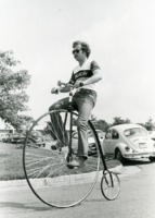 Student riding a penny-farthing at UAH.