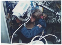 Jan Davis working in the Space Habitation Module on Space Shuttle <i>Discovery</i>.