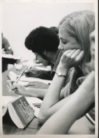 Students writing in class.