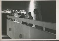 Students look over the balcony at Roberts Hall.