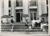 Students socializing on the front steps of Morton Hall.