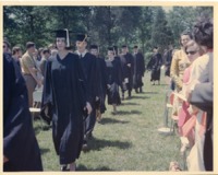 Members of the class of 1970 processing through the crowd at commencement.