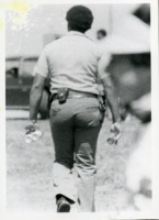 UAH Police Corporal Jeff Hood confiscates beer from non-UAH Springfest goers.