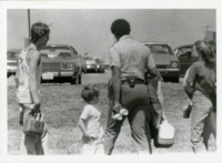 UAH Police Corporal Jeff Hood confiscates beer from non-UAH Springfest goers.