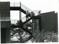 Students on the stairs at Southeast Campus Housing.