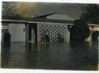 Students wading in floodwater at UAH Community Housing. 