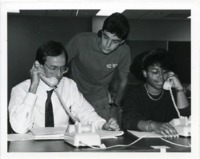 UAH Alumni Board member John W. Harrison answers telephones during a phone-a-thon.