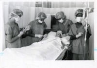 UAH student nurses prepare a Let's Pretend Hospital patient.