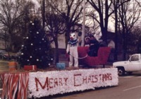 Mascot Charger Blue waves from the UAH Christmas parade float.