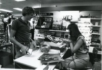 Student purchases record albums at the UAH bookstore.