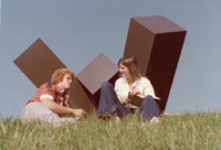 Students socialize at the "Alabama U" sculpture on campus near Roberts Hall.