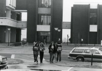 Students cross Ben Graves Drive in front of Roberts Hall.