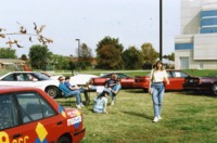 Members of UAH Society of Automotive Engineers socialize outside the Materials Science Building.
