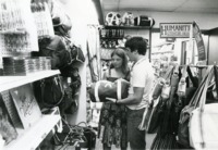 Students examining duffel bags for sale at the UAH Book Nook.