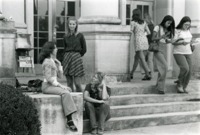 Students talk on the front steps of Morton Hall.