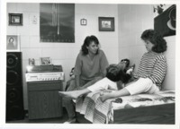 Students relax in a dorm room at Southeast Campus Housing.
