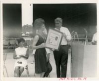 Wernher von Braun presents an Award of Achievement to Jean Drake at the 1969 MSFC employee picnic.