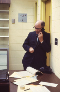 UAH administrator Philip M. Mason taking a phone call.