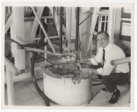 Photo of a team member with the lunar drill.