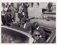 President John F. Kennedy being interviewed by a reporter while MSFC director Wernher von Braun looks on.