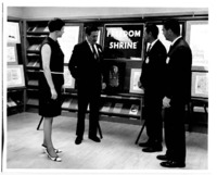 Faculty members confer near the "Freedom Shrine" at the UAH Library.
