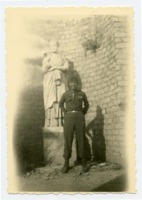 Louis Salmon poses with a statue in France.