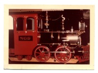 Photograph of red, black, and silver train engine "No. 9."