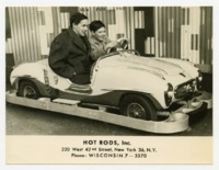 Man and Boy in Hot Rods, Inc. car.
