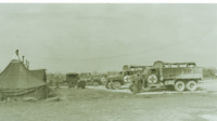 Photograph of parked hospital trucks at the 95th Evacuatin Hospital.
