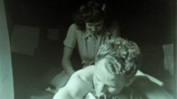 Photograph of a man with a nurse in the 95th Evacuation Hopital.