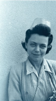 Photograph of nurse outside on the balcony at the 300th General Hospital in Naples, Italy.