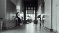 Photograph of people in the hallway at the 300th General Hospital in Naples, Italy.
