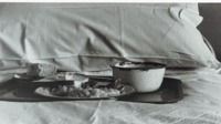 Photograph of a meal on a tray on a bed in the 300th General Hospital in Naples, Italy.
