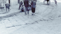 Photograph of people walking around in Naples, Italy.