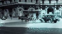 Photograph of a cart led by a donkey on a street in Naples, Italy.