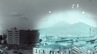 Photograph of a skyline view of Naples, Italy.