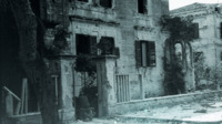 Photograph of a damaged building.