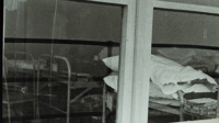 Photograph of the infirmary through the window in the 300th General Hospital in Naples, Italy.