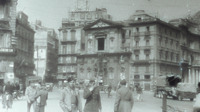 Photograph of soldiers moving around an Italian city.